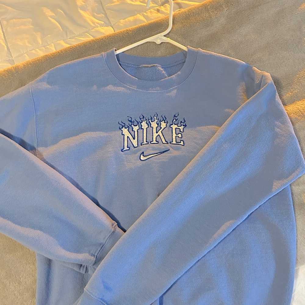 Light blue Nike crew neck sweatshirt